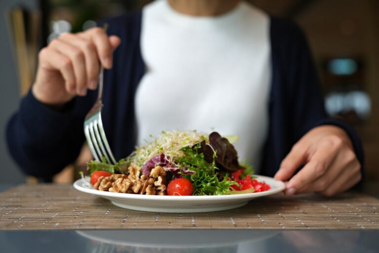 woman eating salad